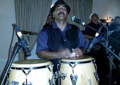 Drummer playing conga drums