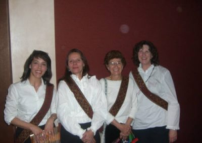 four people posing for a photo