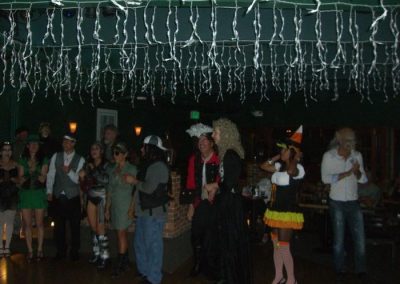 group of people standing around empty dance floor