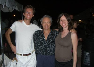 three people pose for a photo