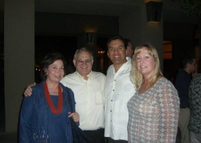 four people posing for a photo