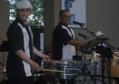 snare drummer and conga drummer playing their instruments
