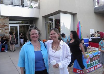 Two ladies posing for picture