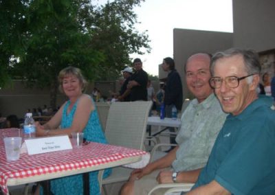 Three people posing for picture